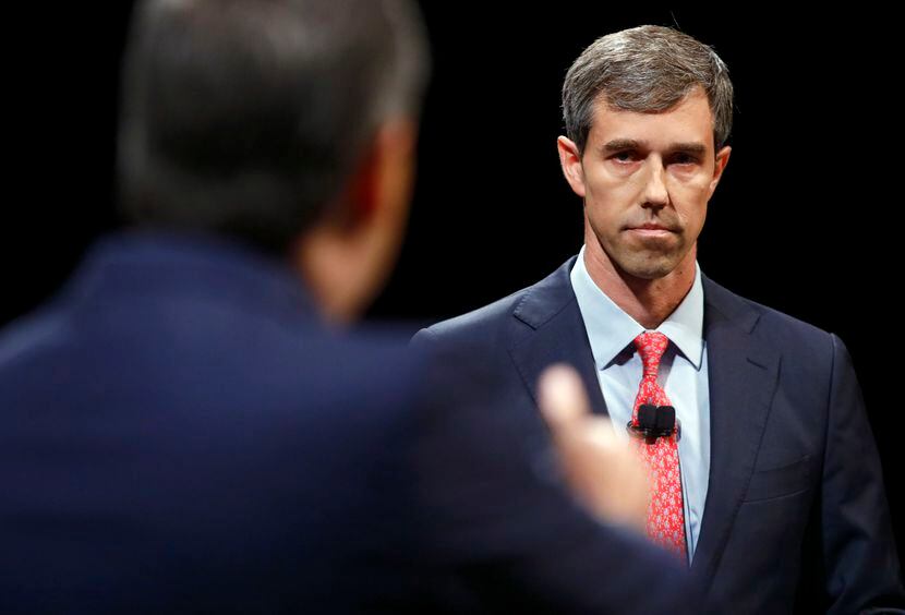 Rep. Beto O'Rourke (D-TX) looks and listens to Sen. Ted Cruz (R-TX) during a debate at...