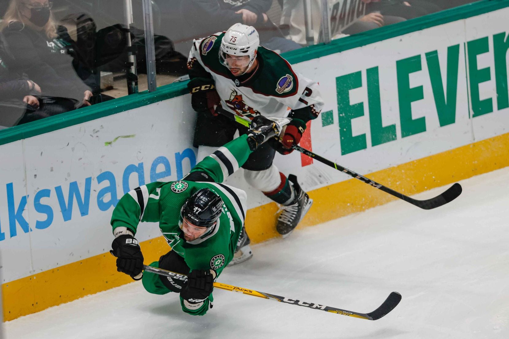 Dallas Stars right wing Alexander Radulov (47) stumbles next to Arizona Coyotes defenseman Kyle Capobianco (75) during first period at the American Airlines Center in Dallas on Monday, December 6, 2021. (Lola Gomez/The Dallas Morning News)
