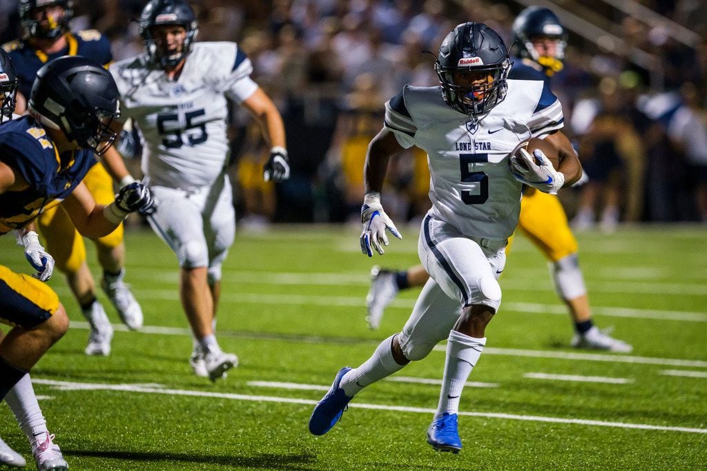 Frisco Lone Star running back Jaden Nixon (5) runs for a first down during the second half...