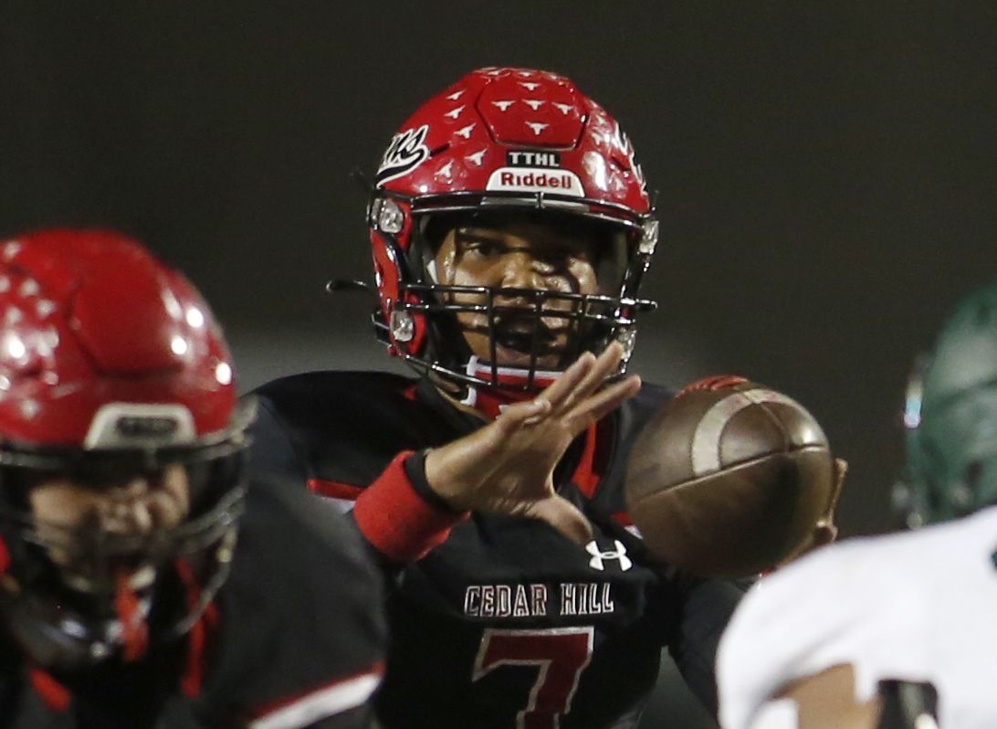 Cedar Hill quarterback Kaidon Salter (7) takes the snap on a drive during the first half of...