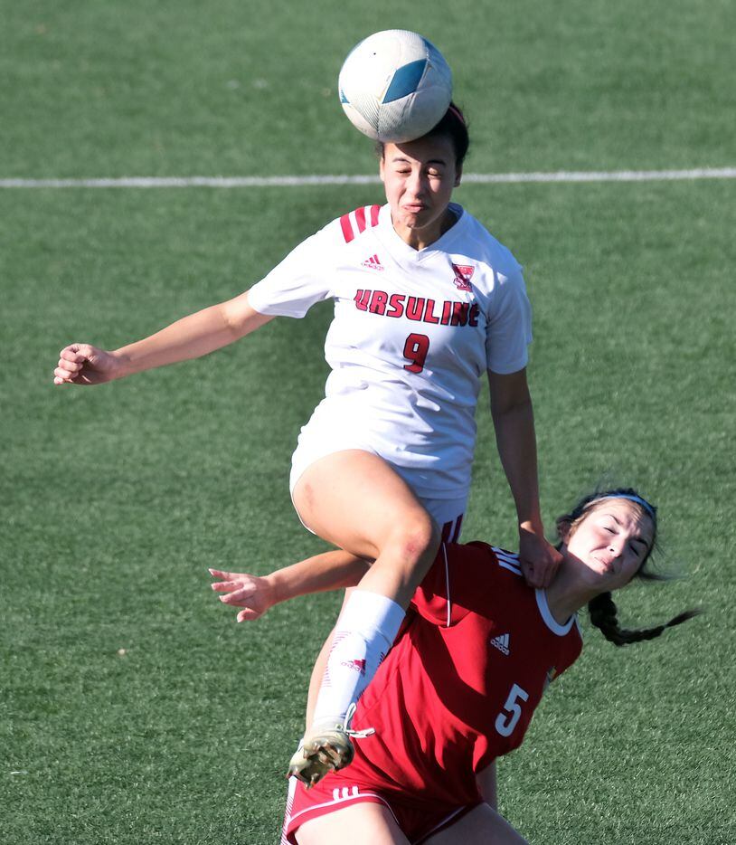 Ursuline #9 Madison Riley takes the header against #5 Erin Dull John Paul II Plano in the...