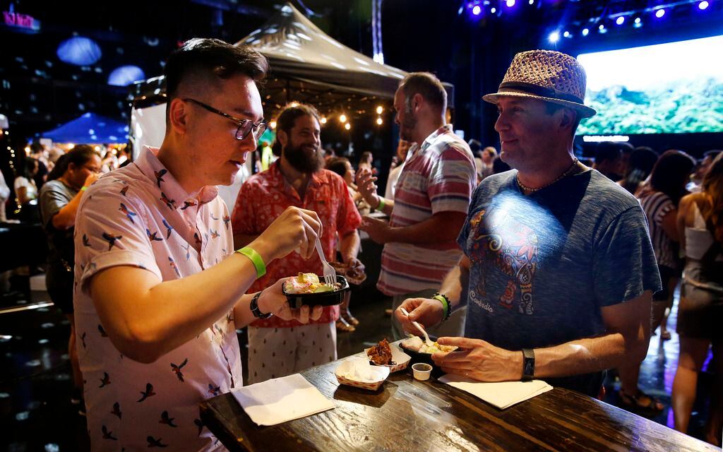Loc Nguyen (left) and Chris Walter taste unique Asian dishes.