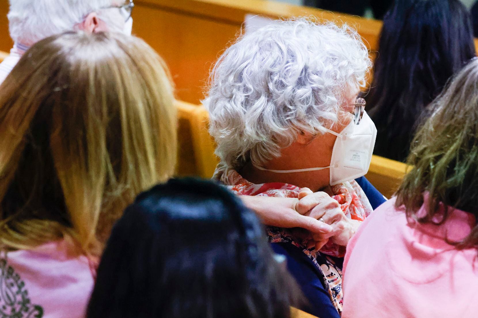 Ann Brooks, oldest daughter of victim Mary Brooks closes her eyes as she reacts to the exact...