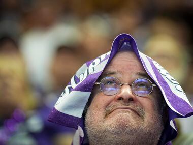TCU fan Bruce Payne reacts after a first half Horned Frogs interception during a College...