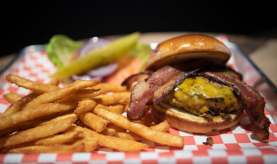 The Bison Burger at Bison Bar and Grill can come topped with bacon and cheese.