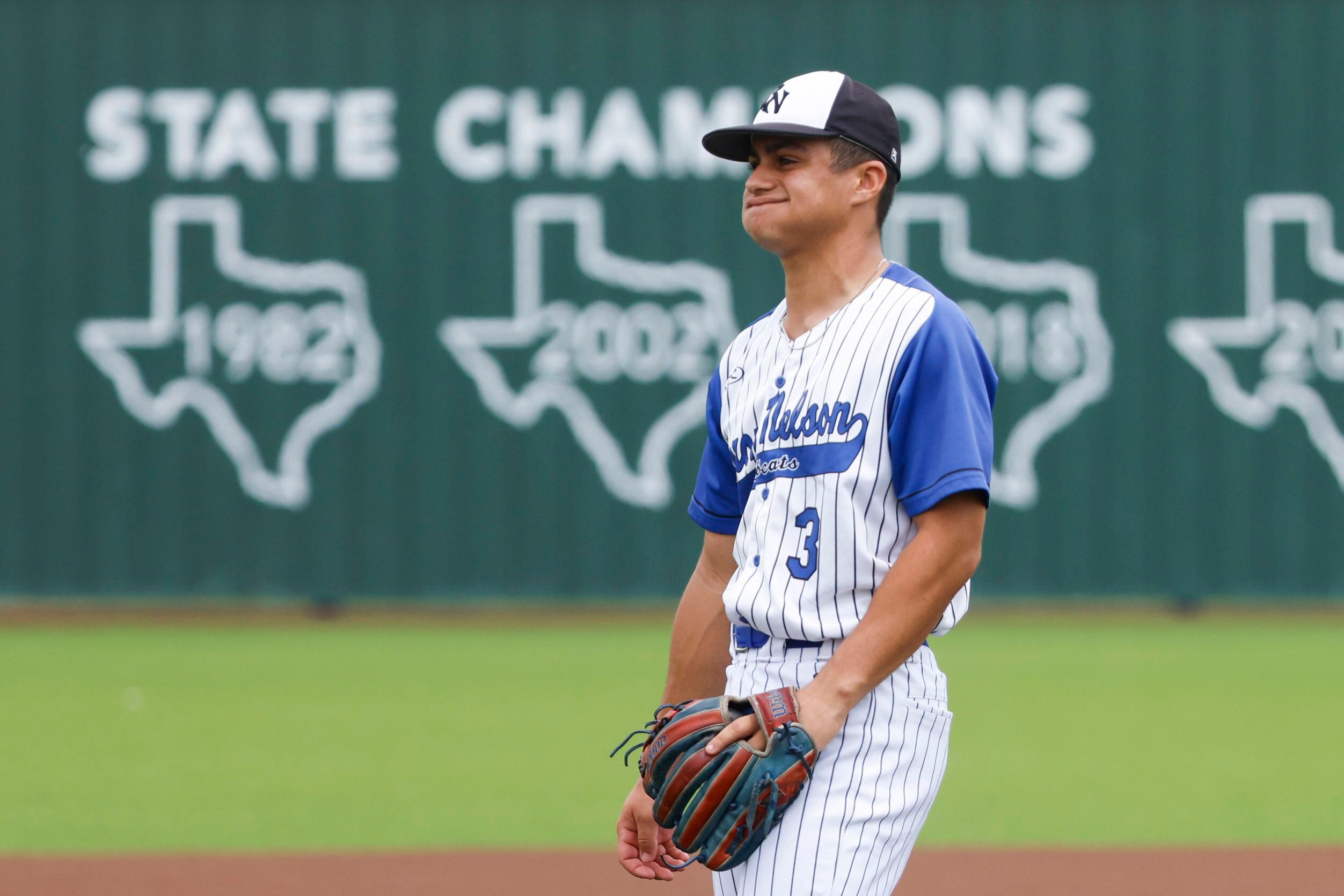 Byron Nelson High School’s Luis Santiago Castro reacts after throwing a pitch during the...