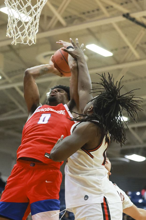 Duncanville High School’s K.J. Lewis (0) is defended by Mansfield Legacy High School’s...