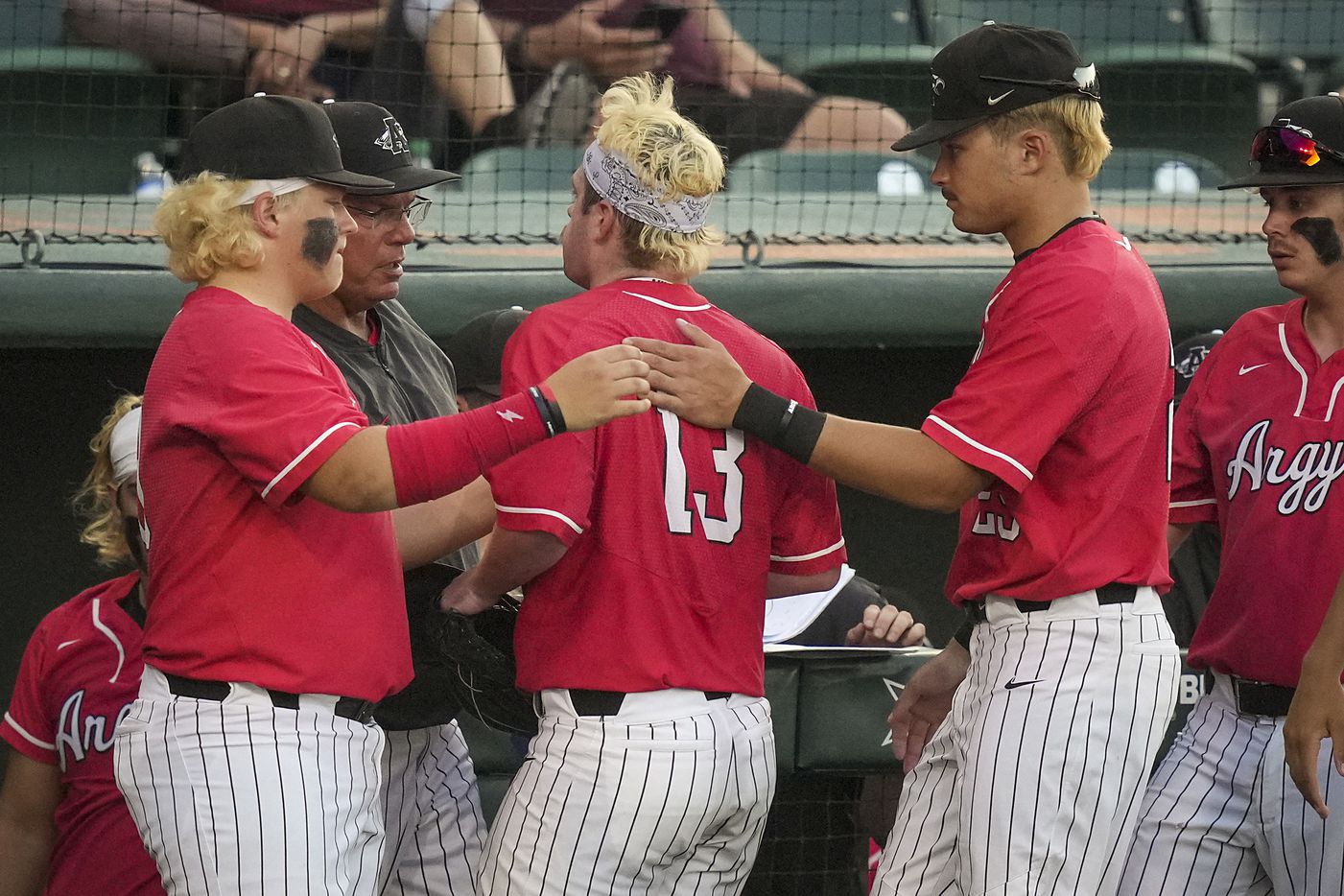 Argyle pitcher Trevor Duck is greeted by teammates as he leaves the game during the third...