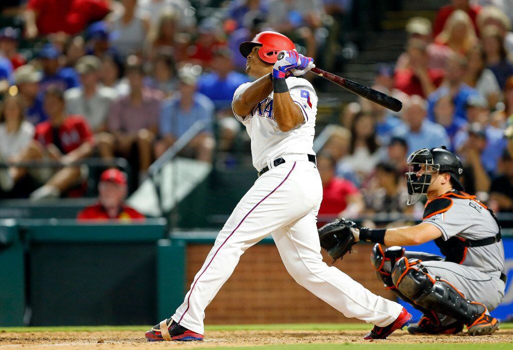 Rangers third baseman Adrian Beltre (29) strokes a double against the Miami Marlins in the...