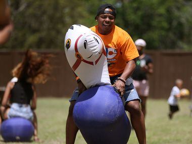 Maddox Jackson competes in a relay during the Black Trans Advocacy Coalition's Family Picnic...