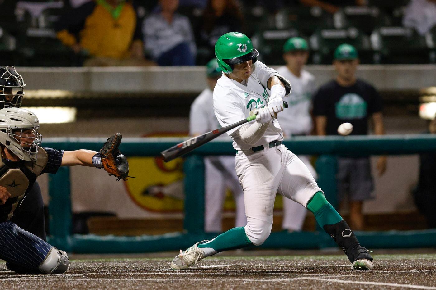 Southlake Carroll left fielder Max Reyes (3) drives in a run on a sacrifice fly to center...