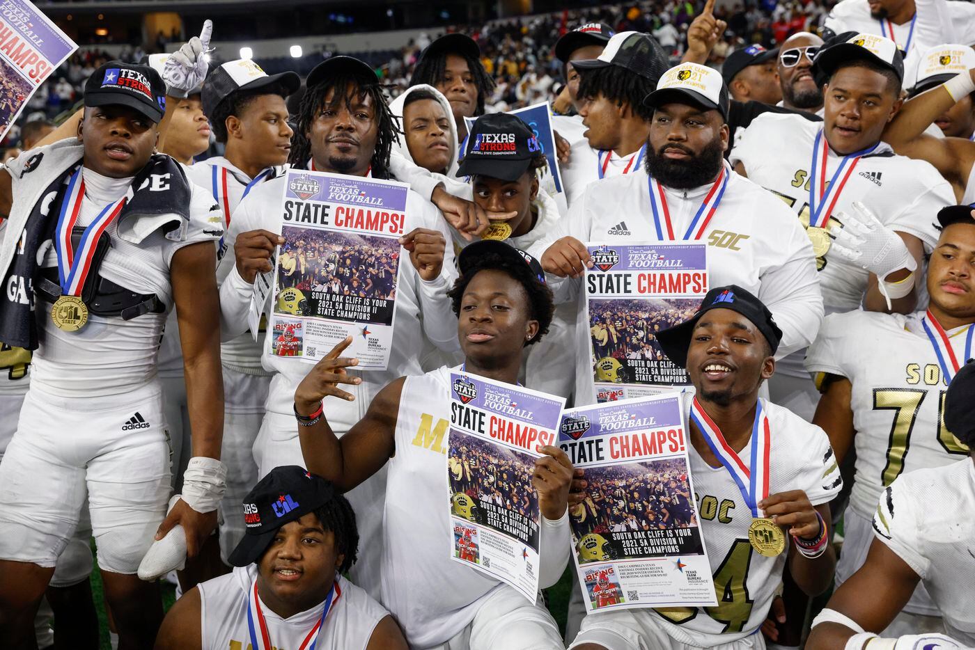 The South Oak Cliff team poses with their medals after winning the Class 5A Division II...