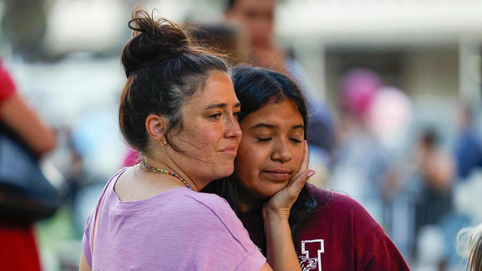 Columbine High School shooting survivor Lauren Bohn, 39, comforts Uvalde resident Aliseya...