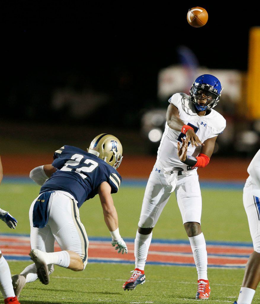 Trinity Christian's Shedeur Sanders (2) attempts a pass as 
Austin Regents Thomas Scully (22) closes in on him during the first half of play at the TAPPS Division II State Championship game at Waco Midway's Panther Stadium in Hewitt, Texas on Friday, December 6, 2019. (Vernon Bryant/The Dallas Morning News)