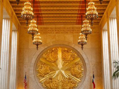 Fair Park's Hall of State gold-leafed medallion represents  the six flags of Texas,...