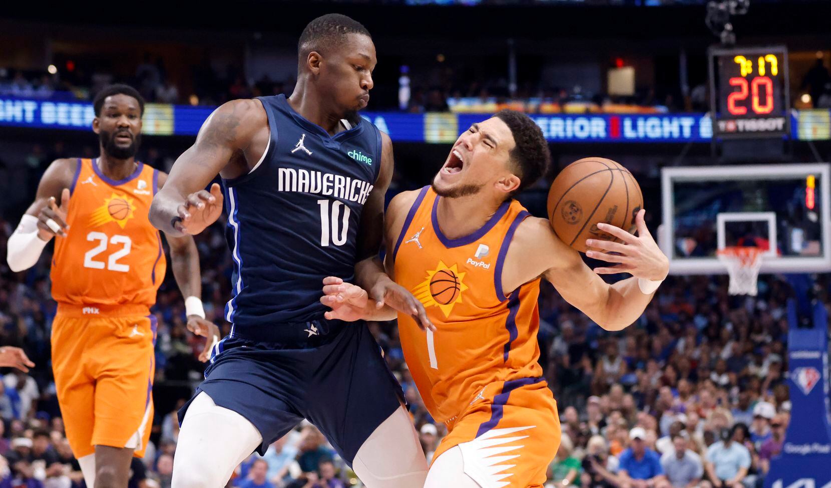 Dallas Mavericks forward Dorian Finney-Smith (10)  closely guards Phoenix Suns guard Devin...