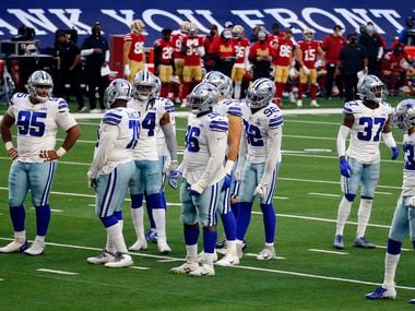 The Dallas Cowboys defense awaits the resumption of play during the fourth quarter against the San Francisco 49ers at the AT&T Stadium in Arlington, Texas, on Sunday, December 20, 2020. The Cowboys win, 41-33.