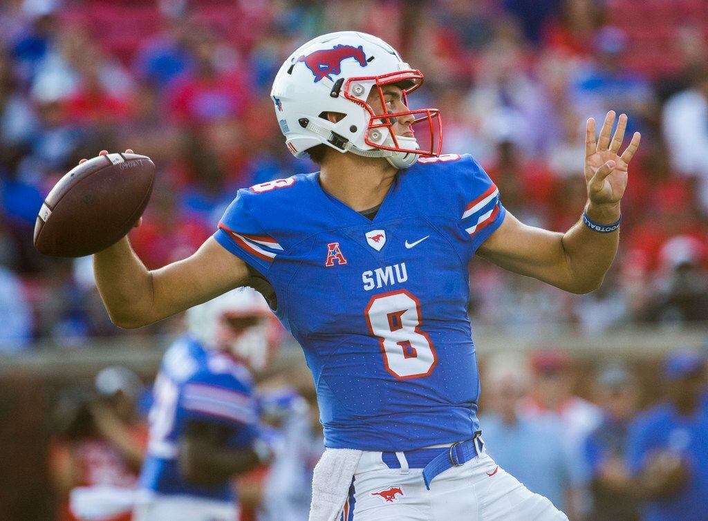 Southern Methodist Mustangs quarterback Ben Hicks (8) throws a pass during the first quarter...