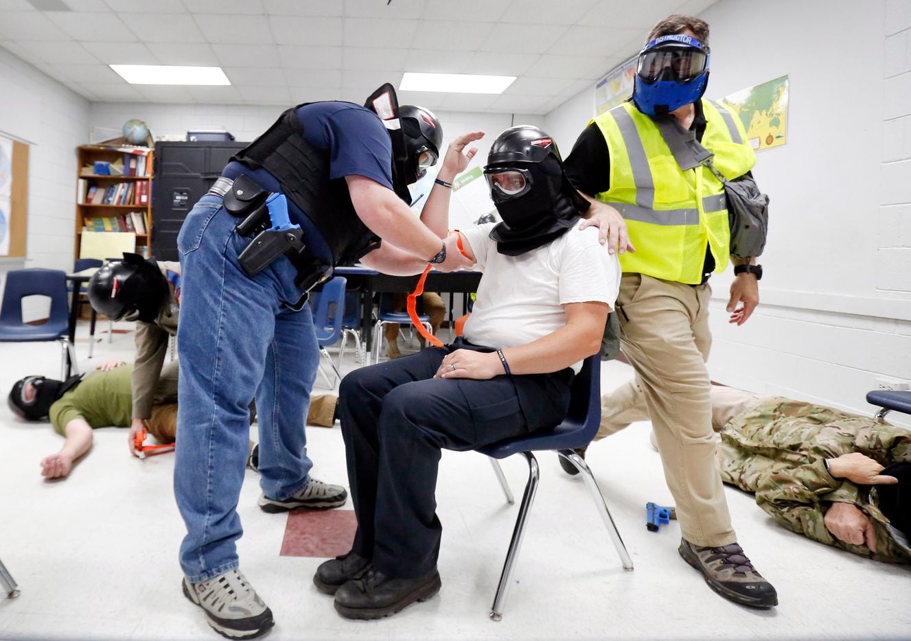 Advanced Law Enforcement Rapid Response Training instructor Will Mercado (right) observes...