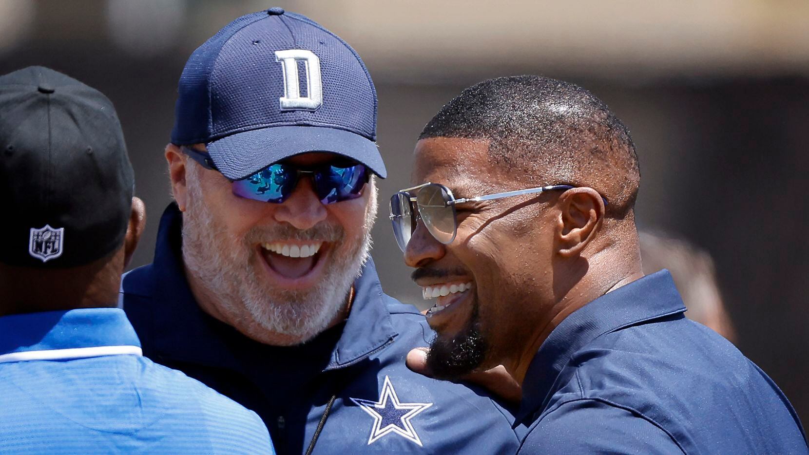 Dallas Cowboys head coach Mike McCarthy visits with actor and fan Jaime Foxx following...