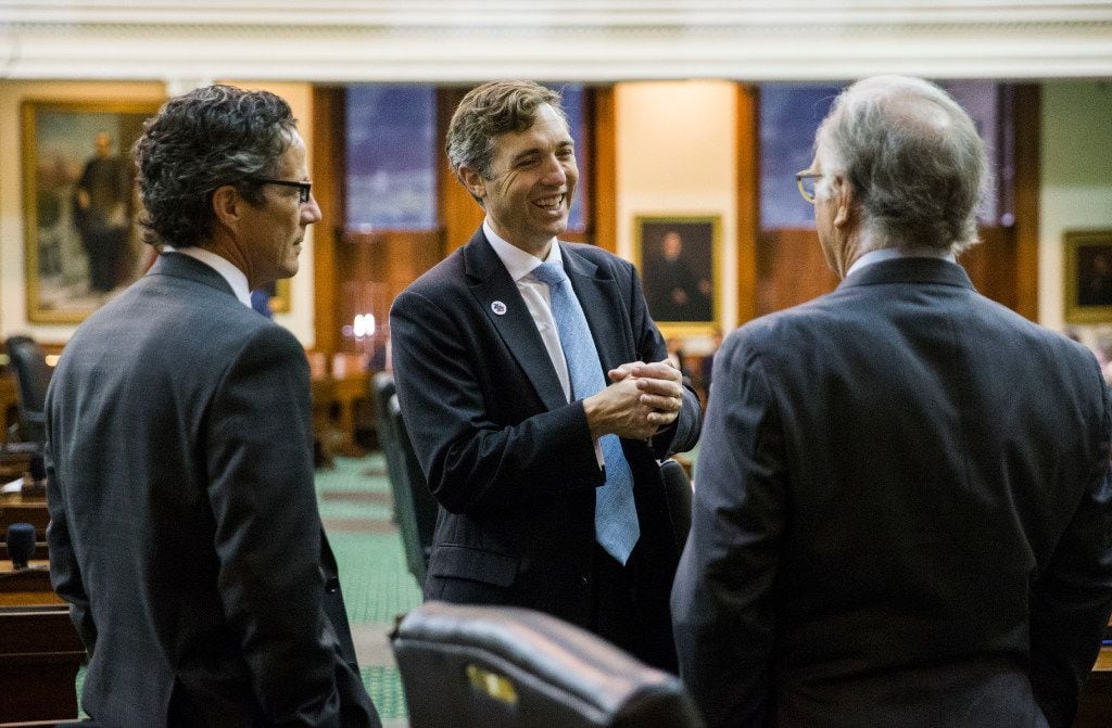Senators Kelly Hancock, left, Van Taylor, center, and Kirk Watson, right, chat before the senate reconvenes at 12:01 a.m. for a third reading of the Sunset Bill during the third day of a special legislative session on Thursday, July 20, 2017 at the Texas state capitol in Austin, Texas.