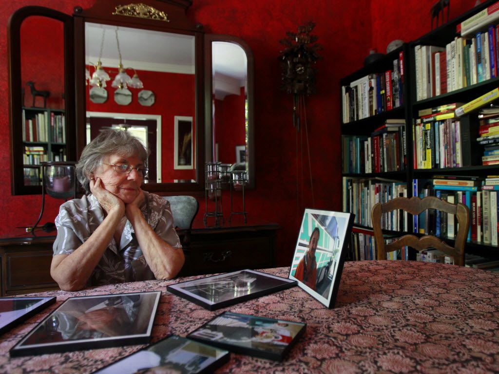 Jane Pena looks at photos of her son, George Cornell, shortly after his death in Parkland...