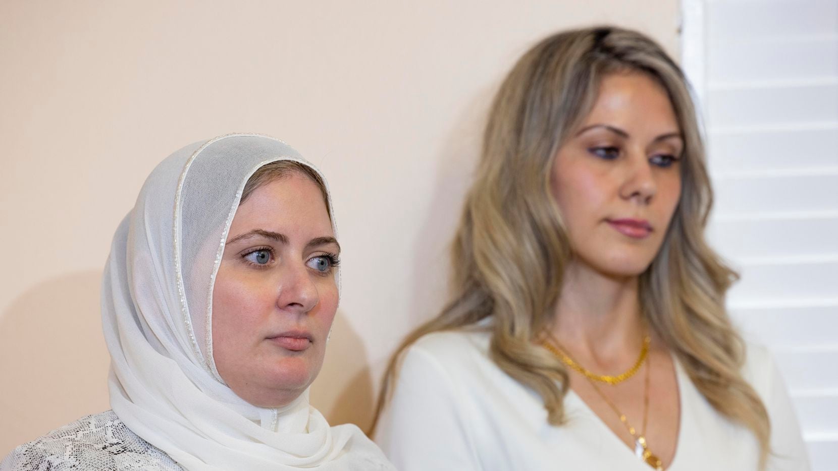 Fatima Altakrouri (left) and sister Muna Kowni listen to their attorney Marwa Elbially at a press conference by the Dallas-Fort-Worth chapter of the Council on American-Islamic Relations outlining a complaint they filed against Southwest Airlines for alleged religious discrimination on Tuesday, June 1, 2021, in Plano. (Juan Figueroa/The Dallas Morning News)
