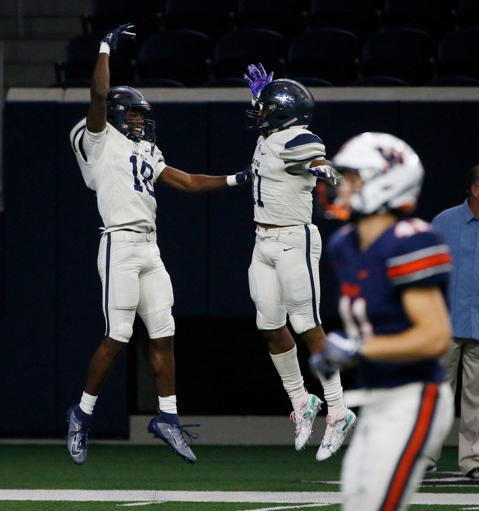 Frisco Lone Star receiver Marvin Mims (18) celebrates his touchdown reception withBrandon...