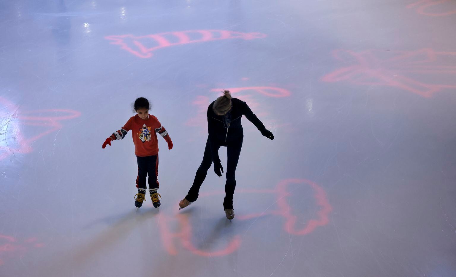 Skaters circle the holiday-themed ice rink at Galleria Dallas.