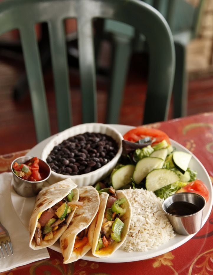 Get your Tex-Mex fix with the Taco Trinity, three soft tacos stuffed with onions, squash,...
