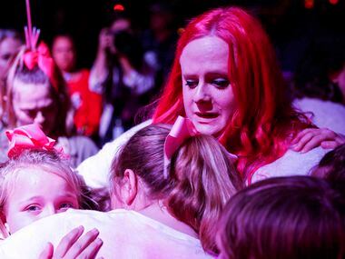 Maitlyn Presley Gandy, mother of late Athena Strand embraces other kids during a memorial...