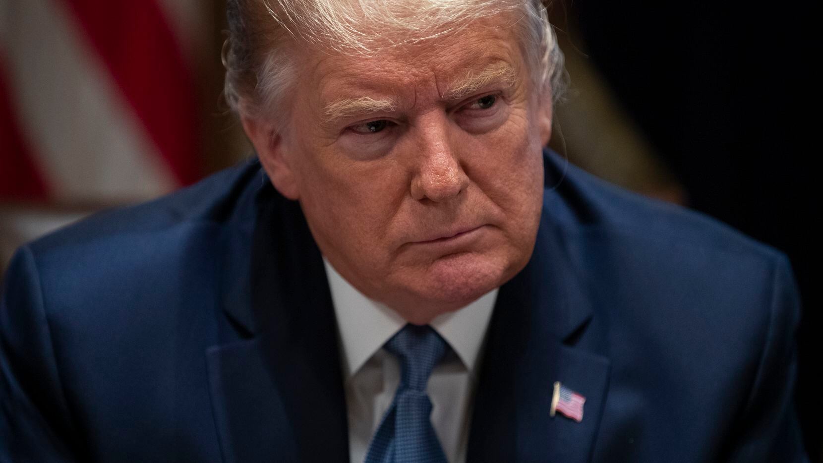 President Donald Trump listens during a roundtable with governors on government regulations in the Cabinet Room of the White House, Monday, Dec. 16, 2019, in Washington.
