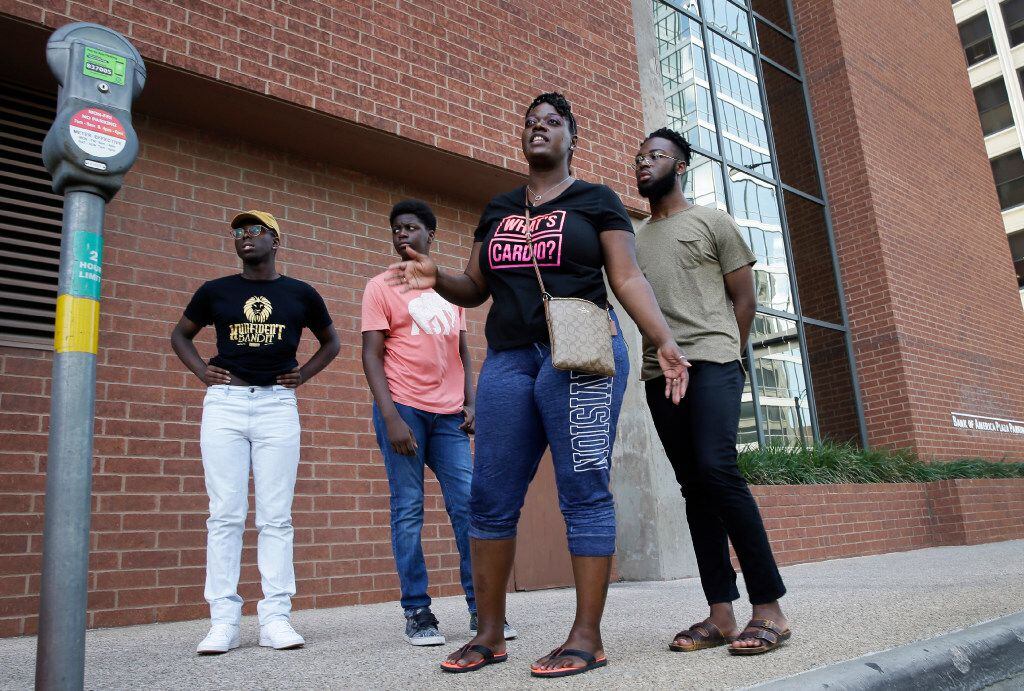 In this June 30, 2017, photo, Shetamia Taylor (second from right) stands where she was shot...