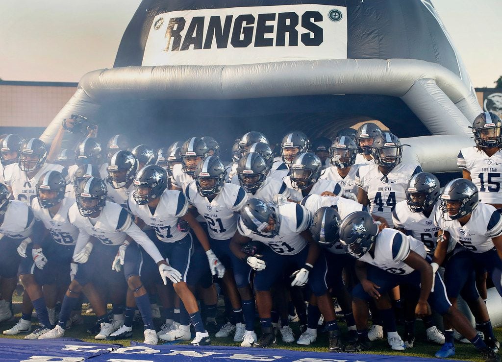The Lone Star High School varsity football team gets set to take the field before kick off...