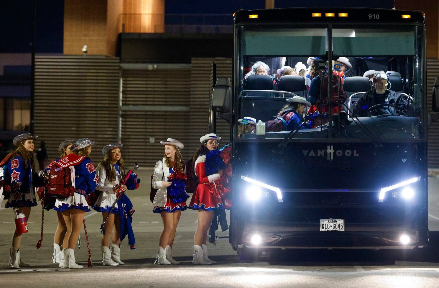 Parish Rosettes members line up to board the bus after performing at their football team’s...