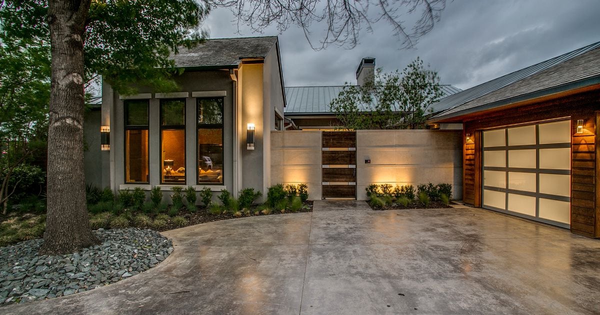 This custom Bluffview home has a private, indoor-outdoor design