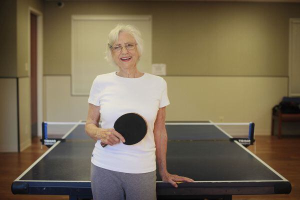 Rec center discounts help Karen Loyd, 78, indulge her love of pingpong.