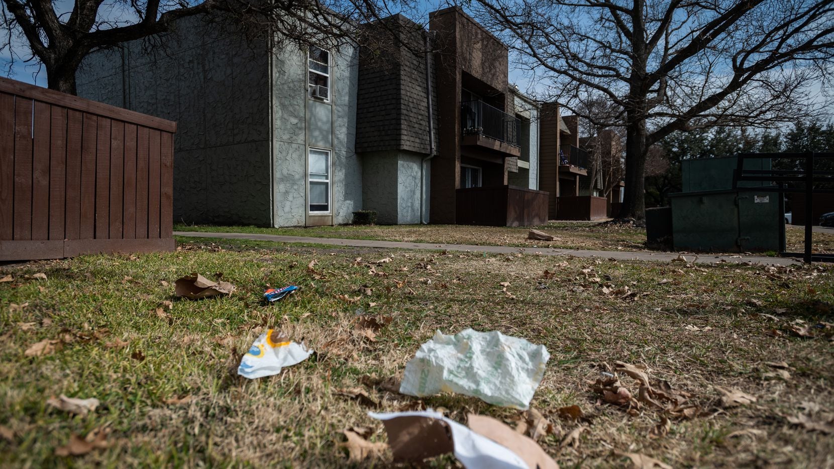 Trash has been blown throughout the complex outside of the Hillcrest apartments in Mesquite,...