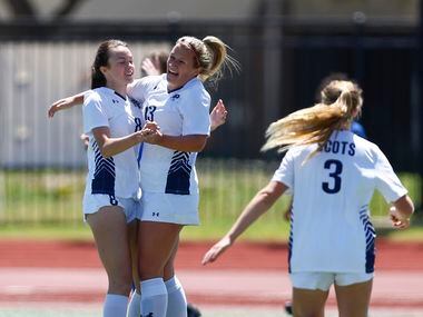 Highland Park’s Elise Borders (13) is congratulated by teammates after scoring a goal during...