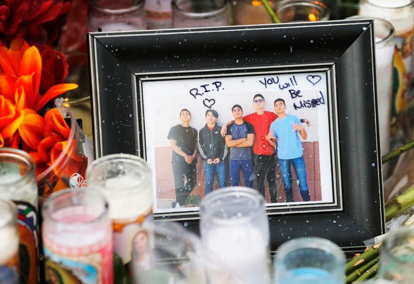 Photo of Javier Amir Rodriguez (second from left) left near a cross with his name on it at a...