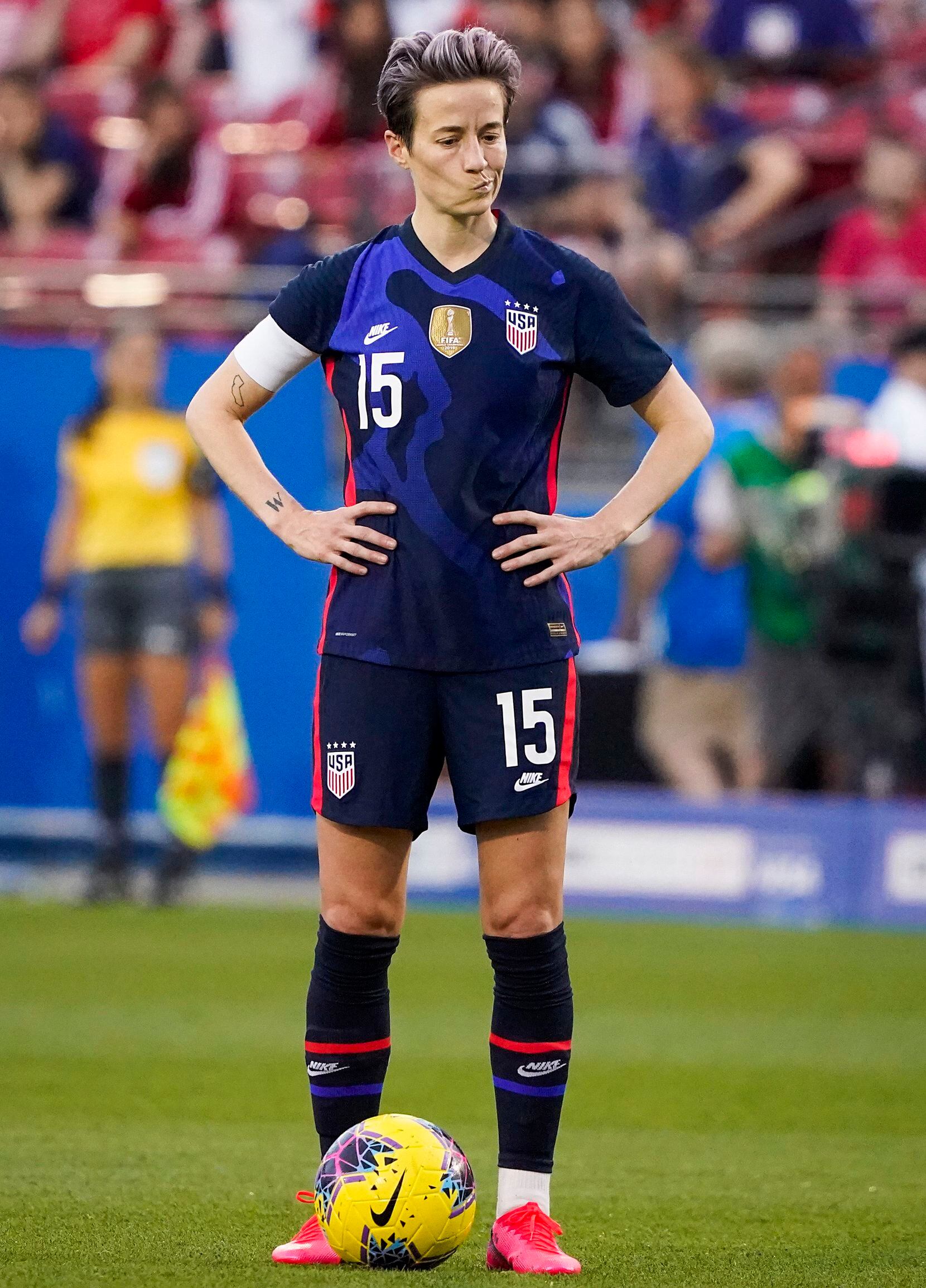 USA forward Megan Rapinoe pauses before scoring on a free kick during the first half of a...