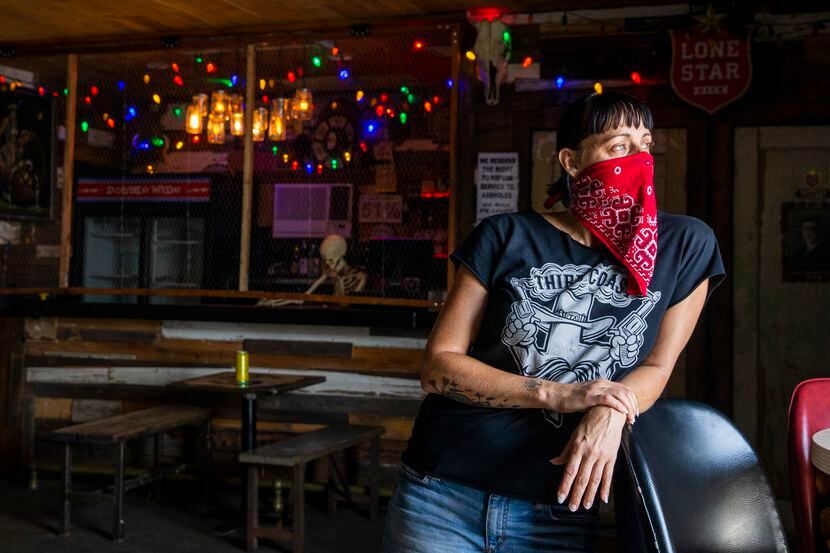 Owner Kim Finch poses for a portrait in the live music area of her bar, Double Wide, in Old...