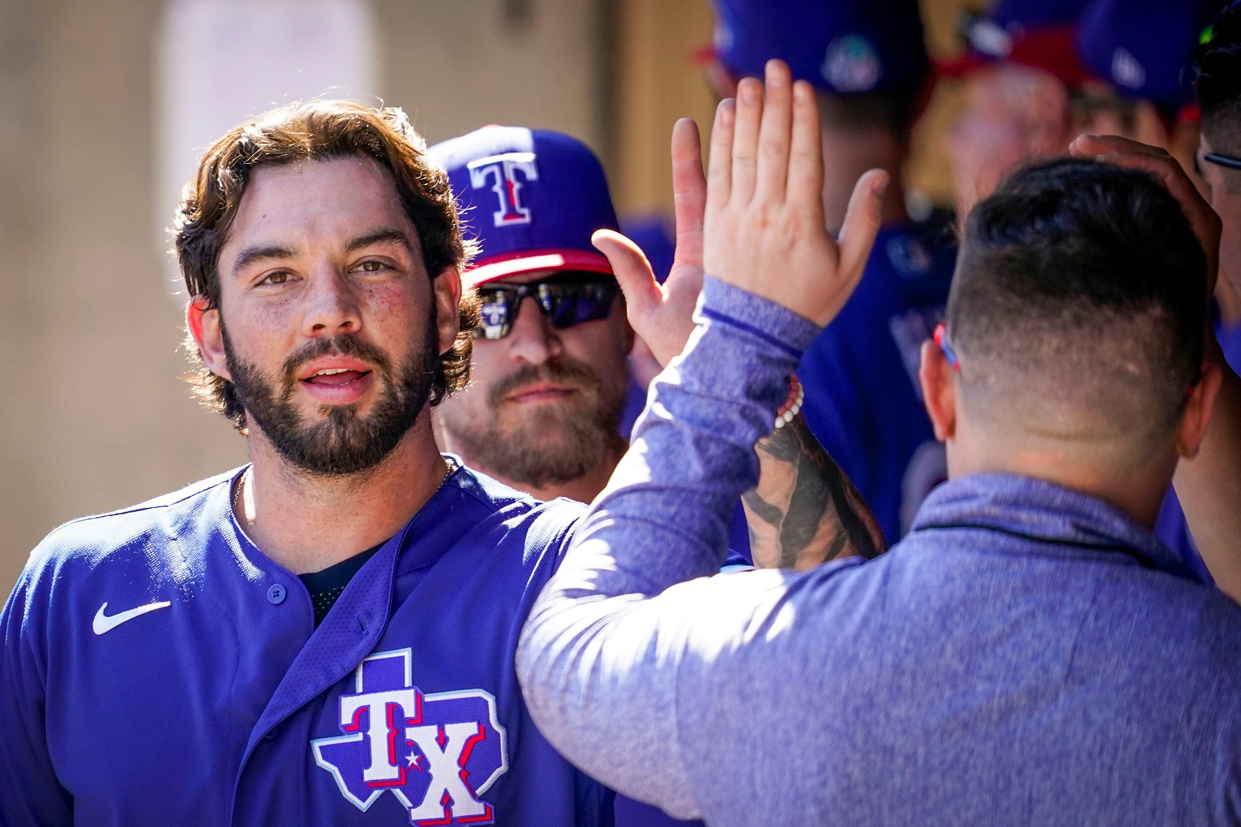 Texas Rangers catcher Blake Swihart celebrates after scoring a run during the third inning...