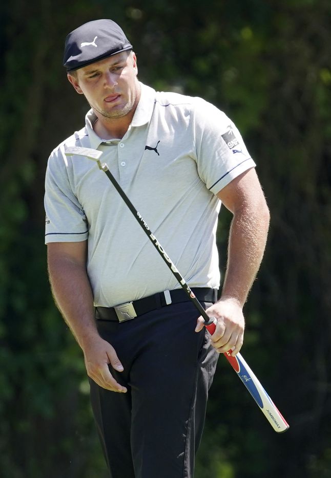 PGA Tour golfer Bryson DeChambeau reacts to his eagle putt on No. 11 during the third round...
