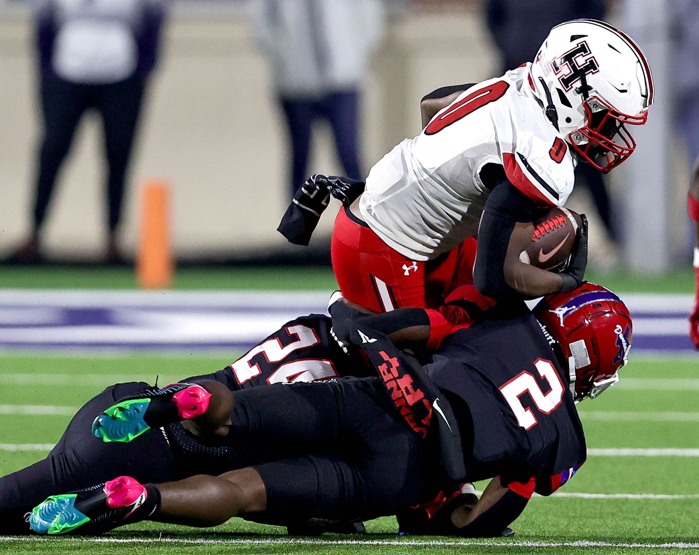 Rockwall Heath running Malachi Tuesno (0) stopped for a short gain by Duncanville defensive...