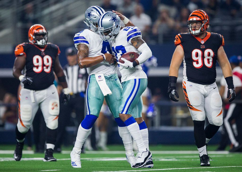 Dallas Cowboys quarterback Dak Prescott (4) celebrates with wide receiver Terrance Williams...