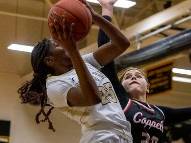 Plano East High School Ada Anamekwe (25) jumps to shoot the ball as Coppell High School...