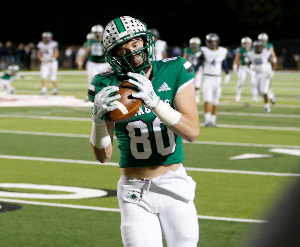 Southlake's Josh Manero (80) catches a long pass against Eaton, during the first half of...