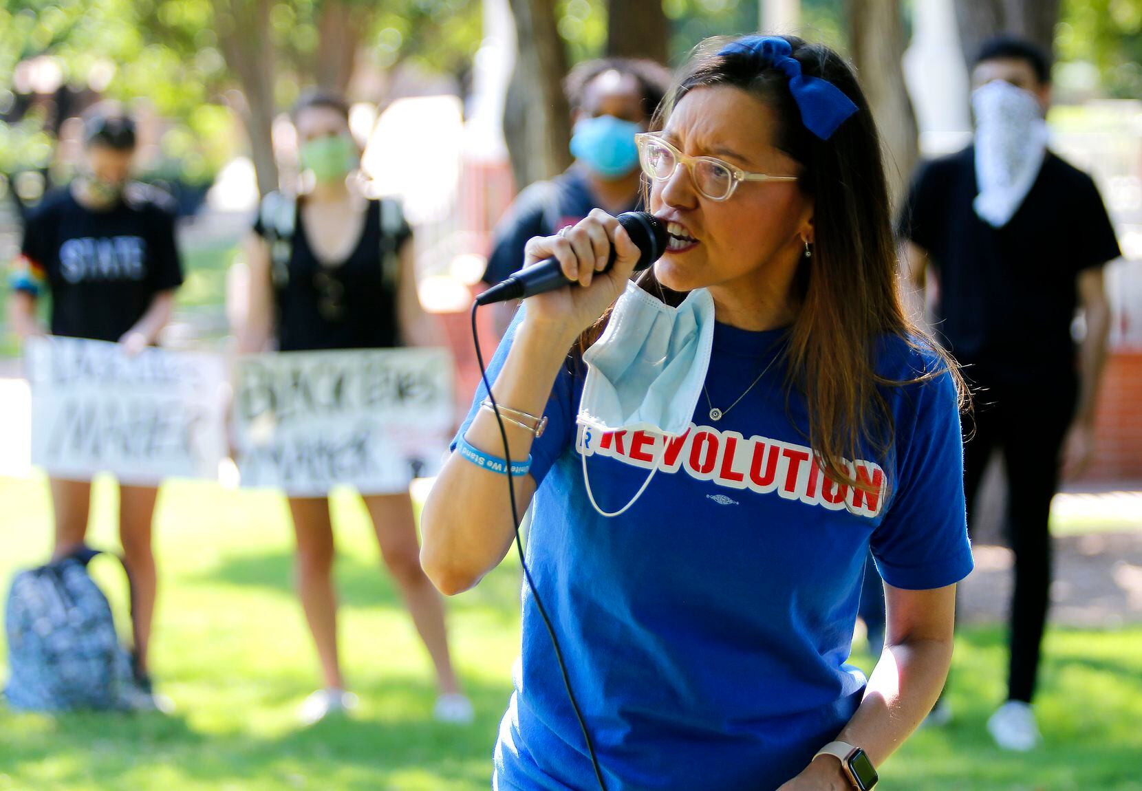 Dallas resident Kristi Lara, an organizer with Our Revolution Texas, speaks at a protest...