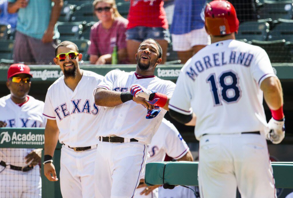 Texas Rangers second baseman Rougned Odor (12) and shortstop Elvis Andrus (1) react as first...